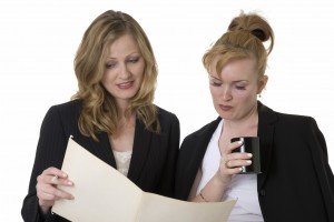 Coworkers discussing a file Delegation Discussion